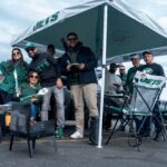A group of fans stand for a photo while tailgating before an NFL Week 10 game between the New York Jets and the Cleveland Browns at MetLife Stadium on Sunday, Nov. 9, 2025. Credit: Julian Leshay Guadalupe/NorthJersey.com / USA TODAY NETWORK via Imagn Images