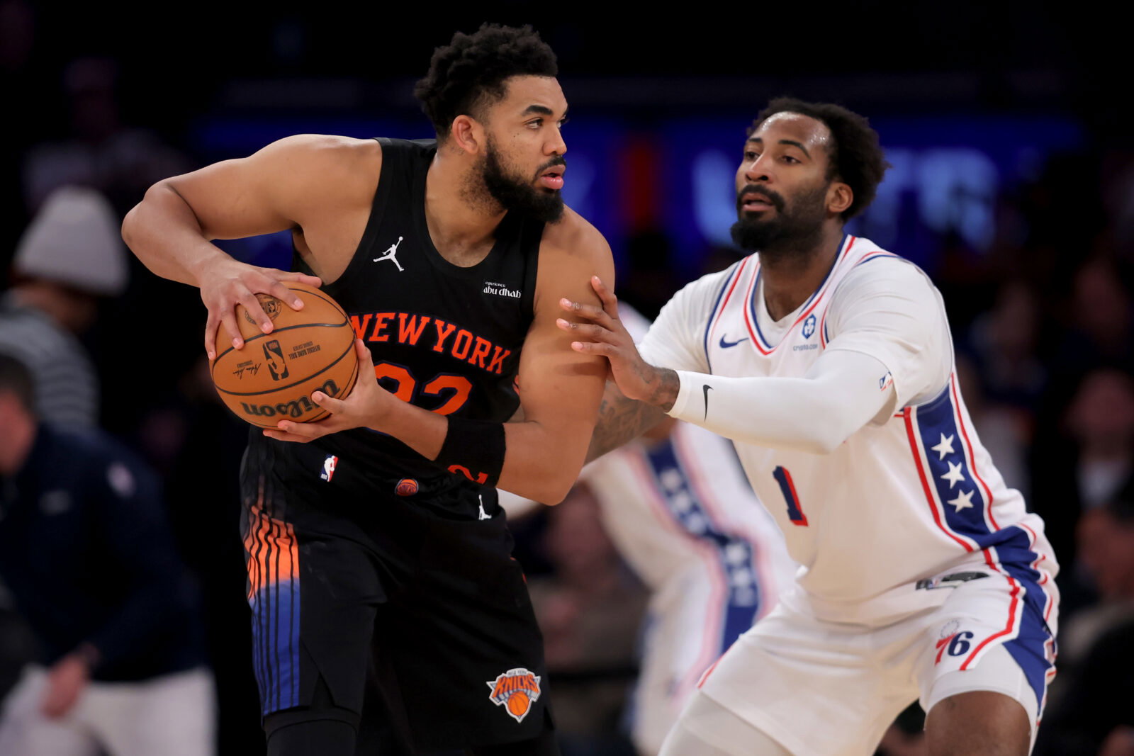 Dec 19, 2025; New York, New York, USA; New York Knicks center Karl-Anthony Towns (32) controls the ball against Philadelphia 76ers center Andre Drummond (1) during the third quarter at Madison Square Garden. Mandatory Credit: Brad Penner-Imagn Images