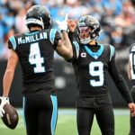 Dec 21, 2025; Charlotte, North Carolina, USA; Carolina Panthers quarterback Bryce Young (9) celebrates with wide receiver Tetairoa McMillan (4) after a play during the first half against the Tampa Bay Buccaneers at Bank of America Stadium. Mandatory Credit: Bob Donnan-Imagn Images