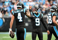 Dec 21, 2025; Charlotte, North Carolina, USA; Carolina Panthers quarterback Bryce Young (9) celebrates with wide receiver Tetairoa McMillan (4) after a play during the first half against the Tampa Bay Buccaneers at Bank of America Stadium. Mandatory Credit: Bob Donnan-Imagn Images