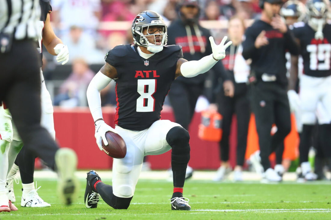 Dec 21, 2025; Glendale, Arizona, USA; Atlanta Falcons tight end Kyle Pitts Sr. (8) reacts after making a first down against the Arizona Cardinals during the first half at State Farm Stadium. Mandatory Credit: Mark J. Rebilas-Imagn Images