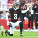 Dec 21, 2025; Glendale, Arizona, USA; Atlanta Falcons tight end Kyle Pitts Sr. (8) reacts after making a first down against the Arizona Cardinals during the first half at State Farm Stadium. Mandatory Credit: Mark J. Rebilas-Imagn Images
