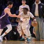 Dec 28, 2025; Los Angeles, California, USA; Sacramento Kings forward Doug McDermott (7) guards Los Angeles Lakers forward Adou Thiero (1) in the second half at Crypto.com Arena. Mandatory Credit: Jayne Kamin-Oncea-Imagn Images