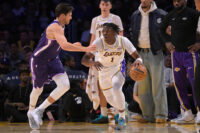 Dec 28, 2025; Los Angeles, California, USA; Sacramento Kings forward Doug McDermott (7) guards Los Angeles Lakers forward Adou Thiero (1) in the second half at Crypto.com Arena. Mandatory Credit: Jayne Kamin-Oncea-Imagn Images