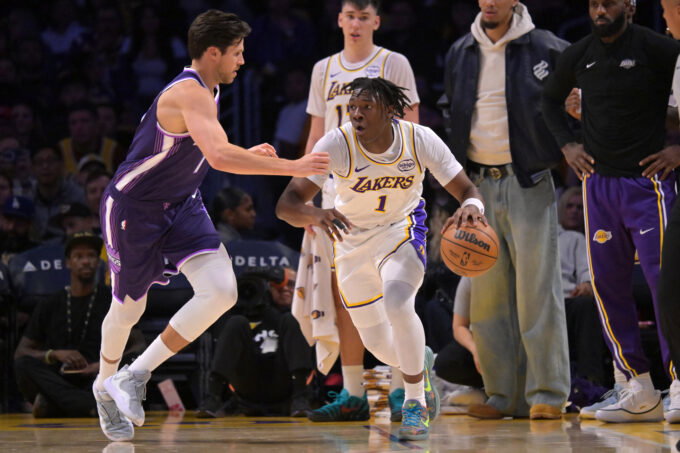 Dec 28, 2025; Los Angeles, California, USA; Sacramento Kings forward Doug McDermott (7) guards Los Angeles Lakers forward Adou Thiero (1) in the second half at Crypto.com Arena. Mandatory Credit: Jayne Kamin-Oncea-Imagn Images