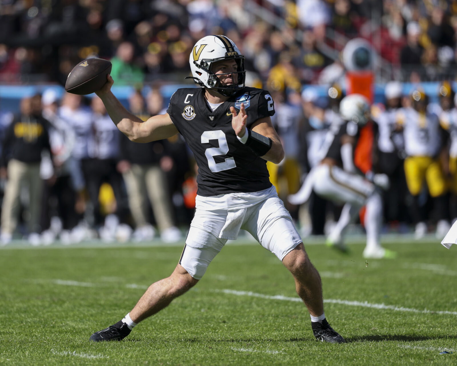 Dec 31, 2025; Tampa, FL, USA; Vanderbilt Commodores quarterback Diego Pavia (2) throws a pass against the Iowa Hawkeyes in the first quarter during the ReliaQuest Bowl at Raymond James Stadium. Mandatory Credit: Nathan Ray Seebeck-Imagn Images