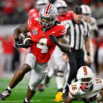 Dec 31, 2025; Arlington, TX, USA; Ohio State Buckeyes wide receiver Jeremiah Smith (4) runs the ball for a touchdown in the third quarter against the Miami Hurricanes during the 2025 Cotton Bowl and quarterfinal game of the College Football Playoff at AT&T Stadium. Mandatory Credit: Jerome Miron-Imagn Images