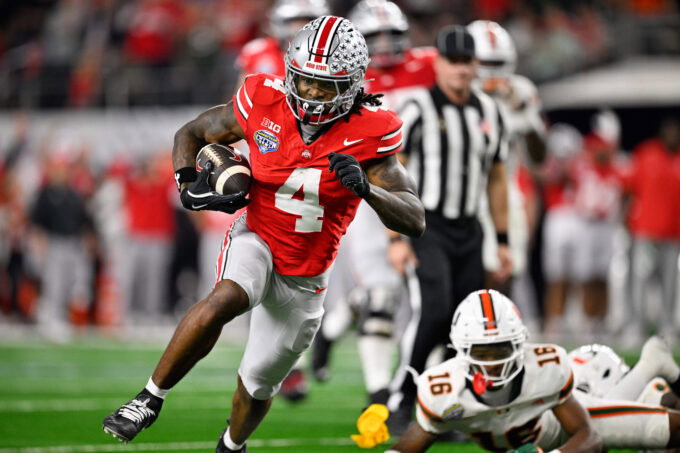 Dec 31, 2025; Arlington, TX, USA; Ohio State Buckeyes wide receiver Jeremiah Smith (4) runs the ball for a touchdown in the third quarter against the Miami Hurricanes during the 2025 Cotton Bowl and quarterfinal game of the College Football Playoff at AT&T Stadium. Mandatory Credit: Jerome Miron-Imagn Images