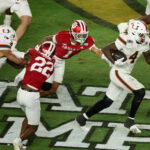 Jan 19, 2026; Miami Gardens, FL, USA; Miami Hurricanes running back Mark Fletcher Jr. (4) carries the ball for a touchdown against the Indiana Hoosiers in the third quarter during the College Football Playoff National Championship game at Hard Rock Stadium. Mandatory Credit: Kim Klement Neitzel-Imagn Images