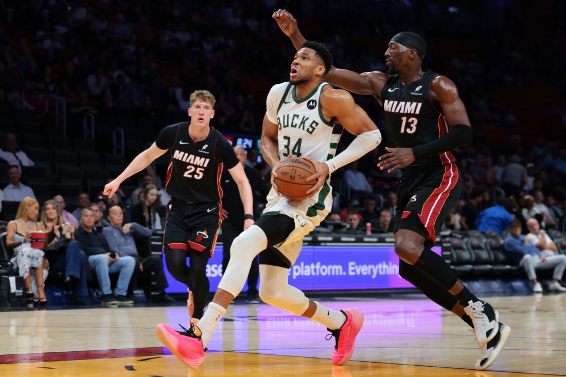 Mar 12, 2026; Miami, Florida, USA; Milwaukee Bucks forward Giannis Antetokounmpo (34) drives to the basket against Miami Heat center Bam Adebayo (13) during the first quarter at Kaseya Center. Mandatory Credit: Sam Navarro-Imagn Images
