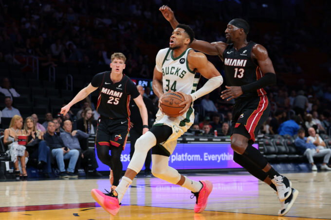 Mar 12, 2026; Miami, Florida, USA; Milwaukee Bucks forward Giannis Antetokounmpo (34) drives to the basket against Miami Heat center Bam Adebayo (13) during the first quarter at Kaseya Center. Mandatory Credit: Sam Navarro-Imagn Images