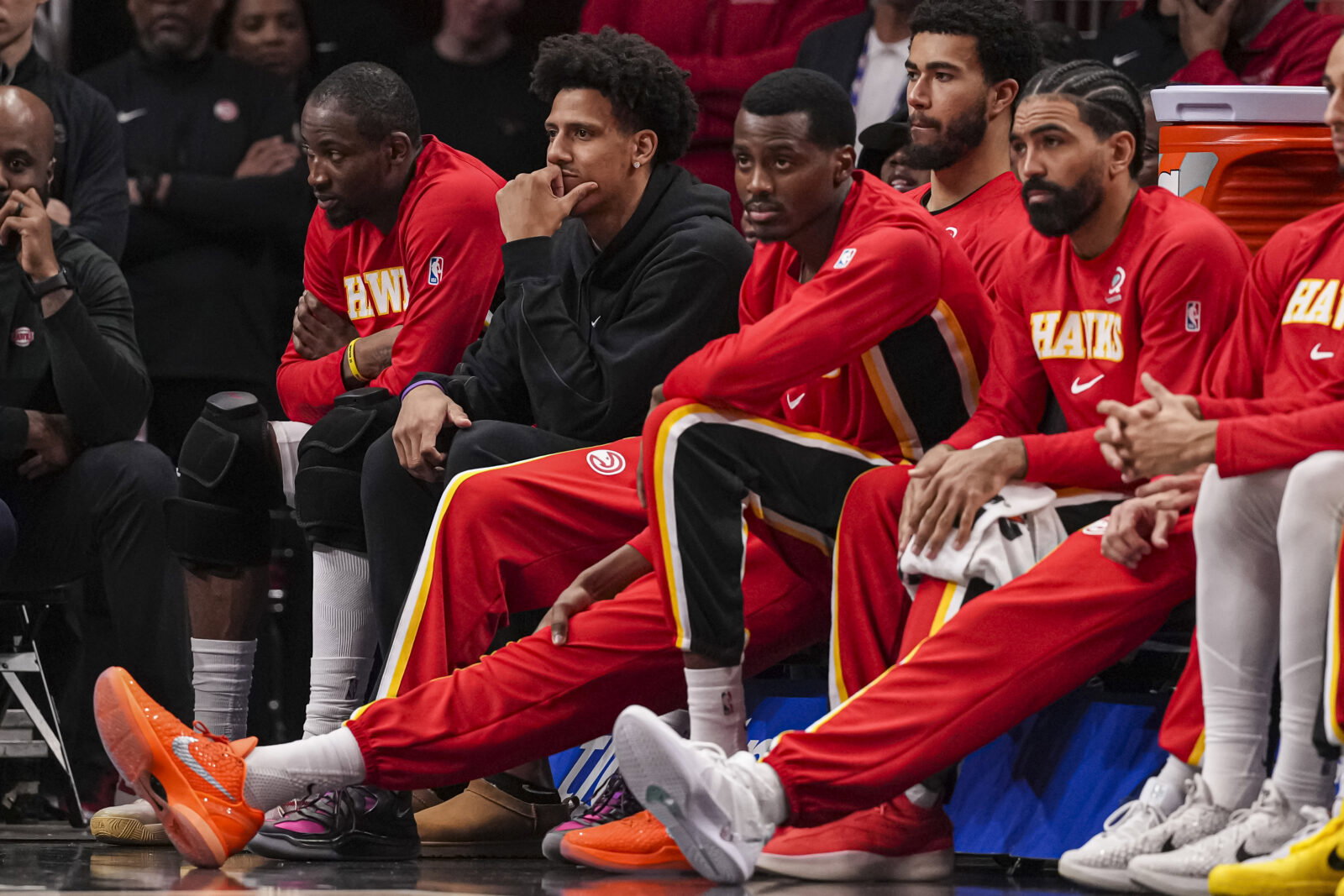 Mar 23, 2026; Atlanta, Georgia, USA; Atlanta Hawks forward Jalen Johnson (dark coat) on the bench with teammates during the game against the Memphis Grizzlies during the second half at State Farm Arena. Mandatory Credit: Dale Zanine-Imagn Images