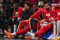 Mar 23, 2026; Atlanta, Georgia, USA; Atlanta Hawks forward Jalen Johnson (dark coat) on the bench with teammates during the game against the Memphis Grizzlies during the second half at State Farm Arena. Mandatory Credit: Dale Zanine-Imagn Images