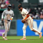 Mar 25, 2026; San Francisco, California, USA; San Francisco Giants second baseman Luis Arraez (1) reacts in front of New York Yankees infielder Jazz Chisholm Jr. (13) after turning a double play in the seventh inning at Oracle Park. Mandatory Credit: Cary Edmondson-Imagn Images