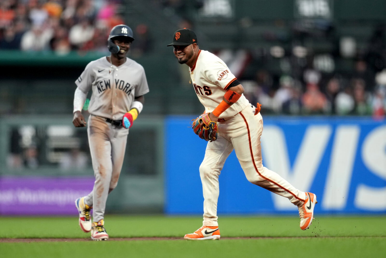 Mar 25, 2026; San Francisco, California, USA; San Francisco Giants second baseman Luis Arraez (1) reacts in front of New York Yankees infielder Jazz Chisholm Jr. (13) after turning a double play in the seventh inning at Oracle Park. Mandatory Credit: Cary Edmondson-Imagn Images
