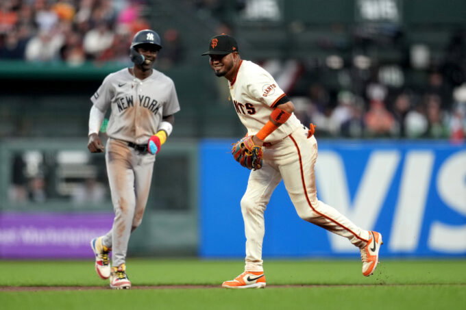 Mar 25, 2026; San Francisco, California, USA; San Francisco Giants second baseman Luis Arraez (1) reacts in front of New York Yankees infielder Jazz Chisholm Jr. (13) after turning a double play in the seventh inning at Oracle Park. Mandatory Credit: Cary Edmondson-Imagn Images