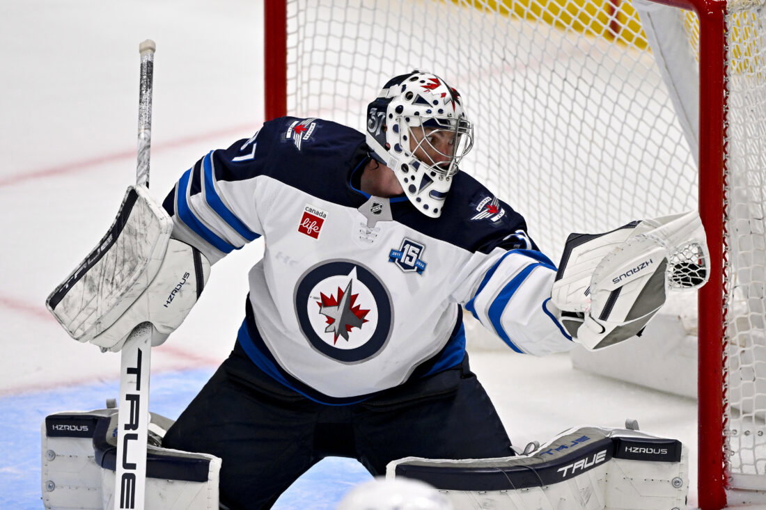Apr 2, 2026; Dallas, Texas, USA; Winnipeg Jets goaltender Connor Hellebuyck (37) makes a glove save on a Dallas Stars shot during the second period at the American Airlines Center. Mandatory Credit: Jerome Miron-Imagn Images