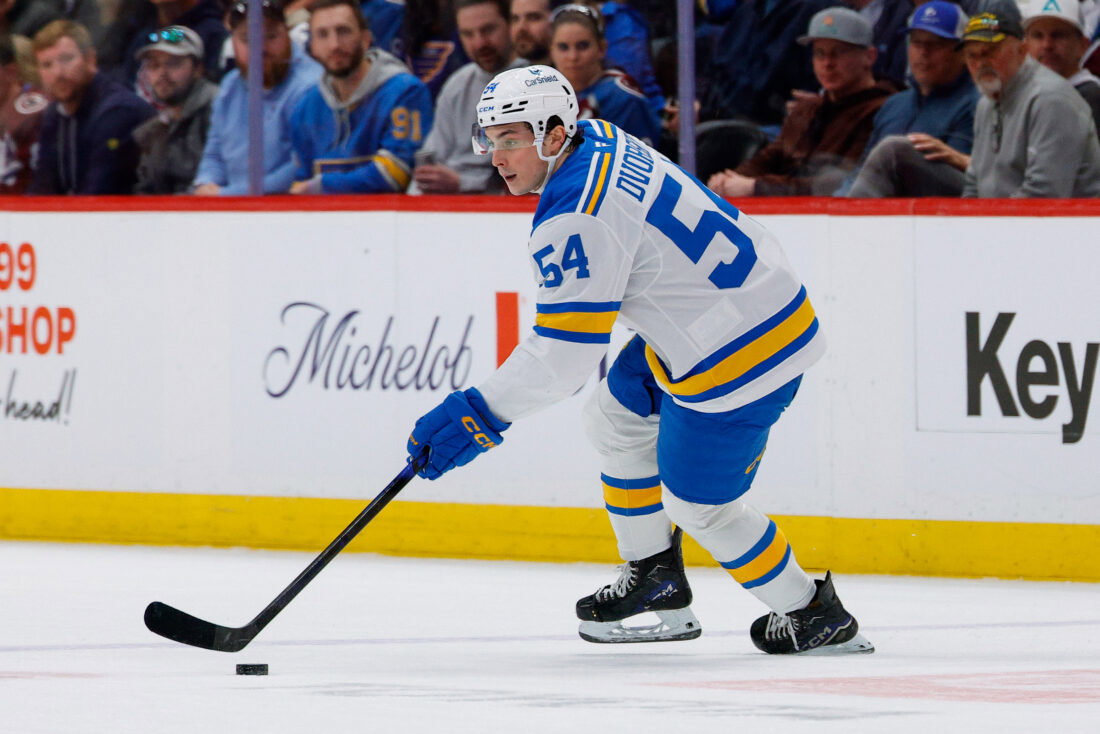 Apr 5, 2026; Denver, Colorado, USA; St. Louis Blues right wing Dalibor Dvorsky (54) controls the puck in the first period against the Colorado Avalanche at Ball Arena. Mandatory Credit: Isaiah J. Downing-Imagn Images