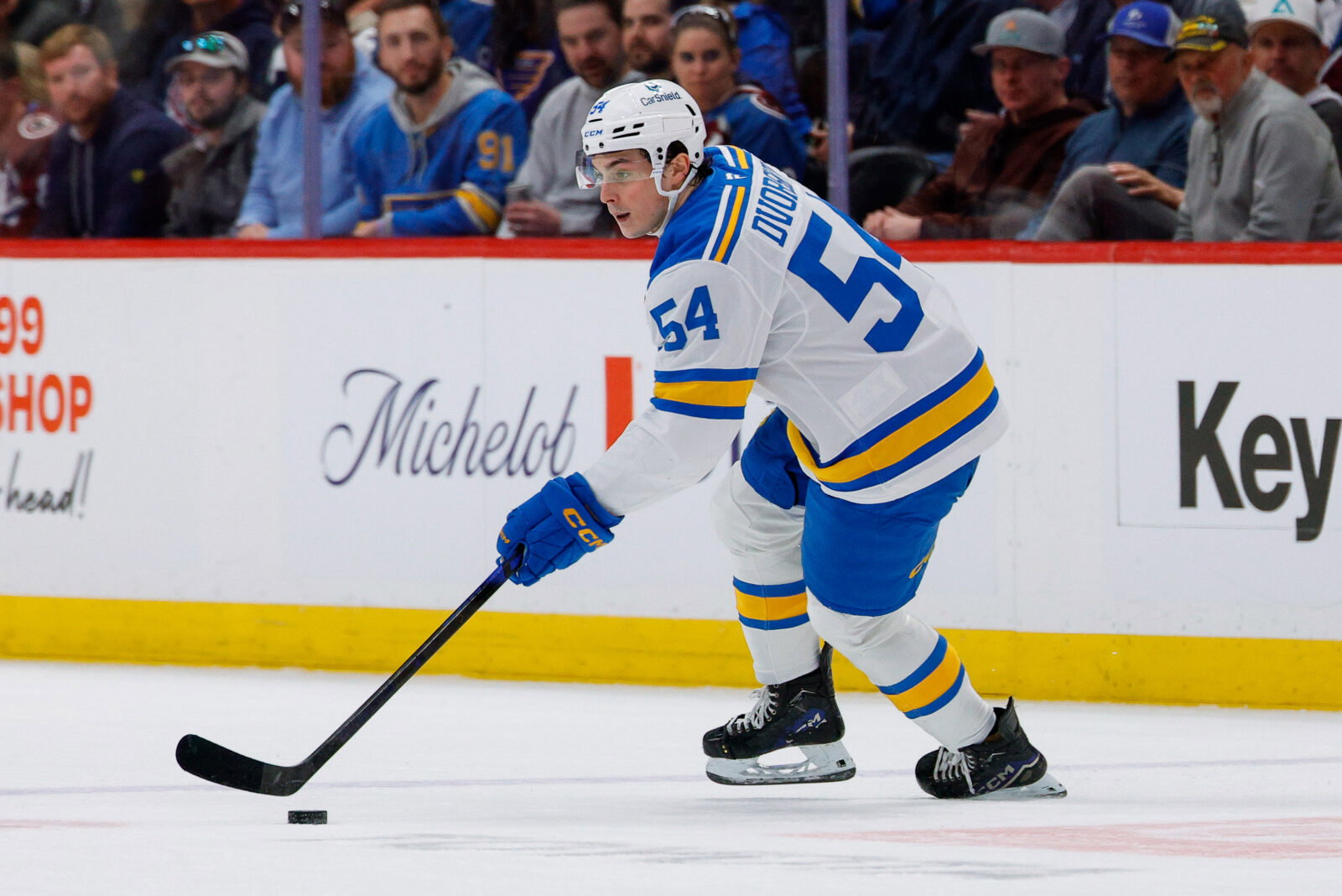 Apr 5, 2026; Denver, Colorado, USA; St. Louis Blues right wing Dalibor Dvorsky (54) controls the puck in the first period against the Colorado Avalanche at Ball Arena. Mandatory Credit: Isaiah J. Downing-Imagn Images