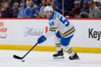 Apr 5, 2026; Denver, Colorado, USA; St. Louis Blues right wing Dalibor Dvorsky (54) controls the puck in the first period against the Colorado Avalanche at Ball Arena. Mandatory Credit: Isaiah J. Downing-Imagn Images