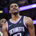 Apr 7, 2026; San Francisco, California, USA; Sacramento Kings center Dylan Cardwell (32) smiles after getting called for a foul against the Golden State Warriors in the fourth quarter at Chase Center. Mandatory Credit: David Gonzales-Imagn Images