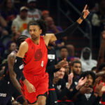 Apr 14, 2026; Phoenix, Arizona, USA; Portland Trail Blazers guard Matisse Thybulle (4) celebrates a three point shot against the Phoenix Suns in the first half during the play-in rounds of the 2026 NBA Playoffs at Mortgage Matchup Center. Mandatory Credit: Mark J. Rebilas-Imagn Images