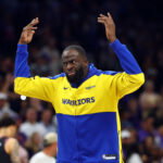 Apr 17, 2026; Phoenix, Arizona, USA; Golden State Warriors forward Draymond Green gestures the crowd after being ejected against the Phoenix Suns during the closing seconds of the play-in rounds of the 2026 NBA Playoffs at Mortgage Matchup Center. Mandatory Credit: Mark J. Rebilas-Imagn Images
