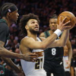 Apr 23, 2026; Minneapolis, Minnesota, USA; Denver Nuggets guard Jamal Murray (27) goes to the basket past Minnesota Timberwolves forward Jaden McDaniels (3) in the fourth quarter at Target Center. Mandatory Credit: Bruce Kluckhohn-Imagn Images
