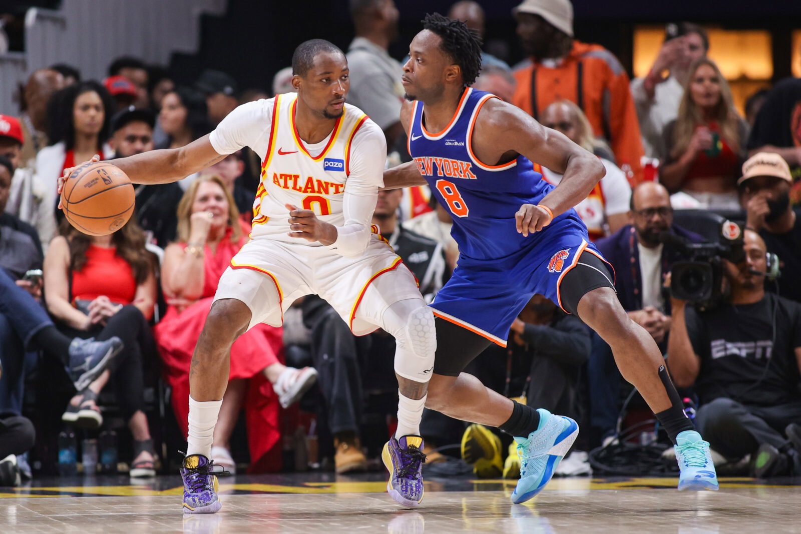 Apr 30, 2026; Atlanta, Georgia, USA; Atlanta Hawks forward Jonathan Kuminga (0) is defended by New York Knicks forward Og Anunoby (8) in the second quarter during game six of the first round of the 2026 NBA Playoffs at State Farm Arena. Mandatory Credit: Brett Davis-Imagn Images