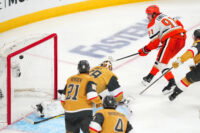May 6, 2026; Las Vegas, Nevada, USA; Anaheim Ducks center Leo Carlsson (91) scores a goal against Vegas Golden Knights goaltender Carter Hart (79) during the third period of game two of the second round of the 2026 Stanley Cup Playoffs at T-Mobile Arena. Mandatory Credit: Stephen R. Sylvanie-Imagn Images