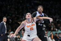 May 8, 2026; Brooklyn, New York, USA; Connecticut Sun center Raegan Beers (15) boxes out New York Liberty center Jonquel Jones (35) during the first half at Barclays Center. Mandatory Credit: John Jones-Imagn Images