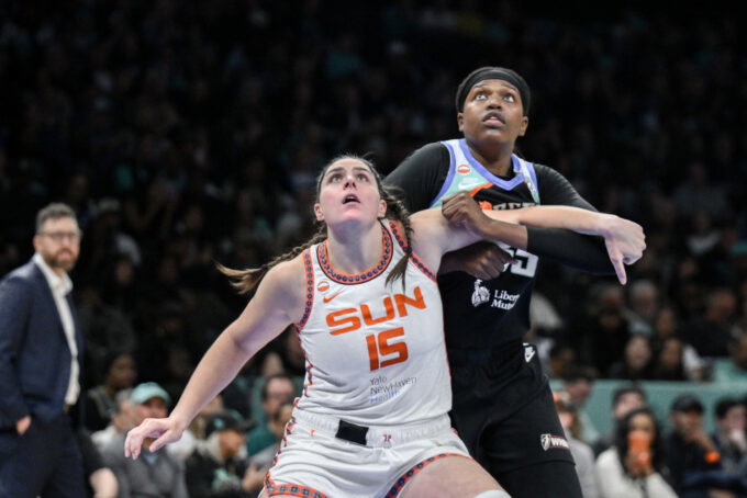 May 8, 2026; Brooklyn, New York, USA; Connecticut Sun center Raegan Beers (15) boxes out New York Liberty center Jonquel Jones (35) during the first half at Barclays Center. Mandatory Credit: John Jones-Imagn Images