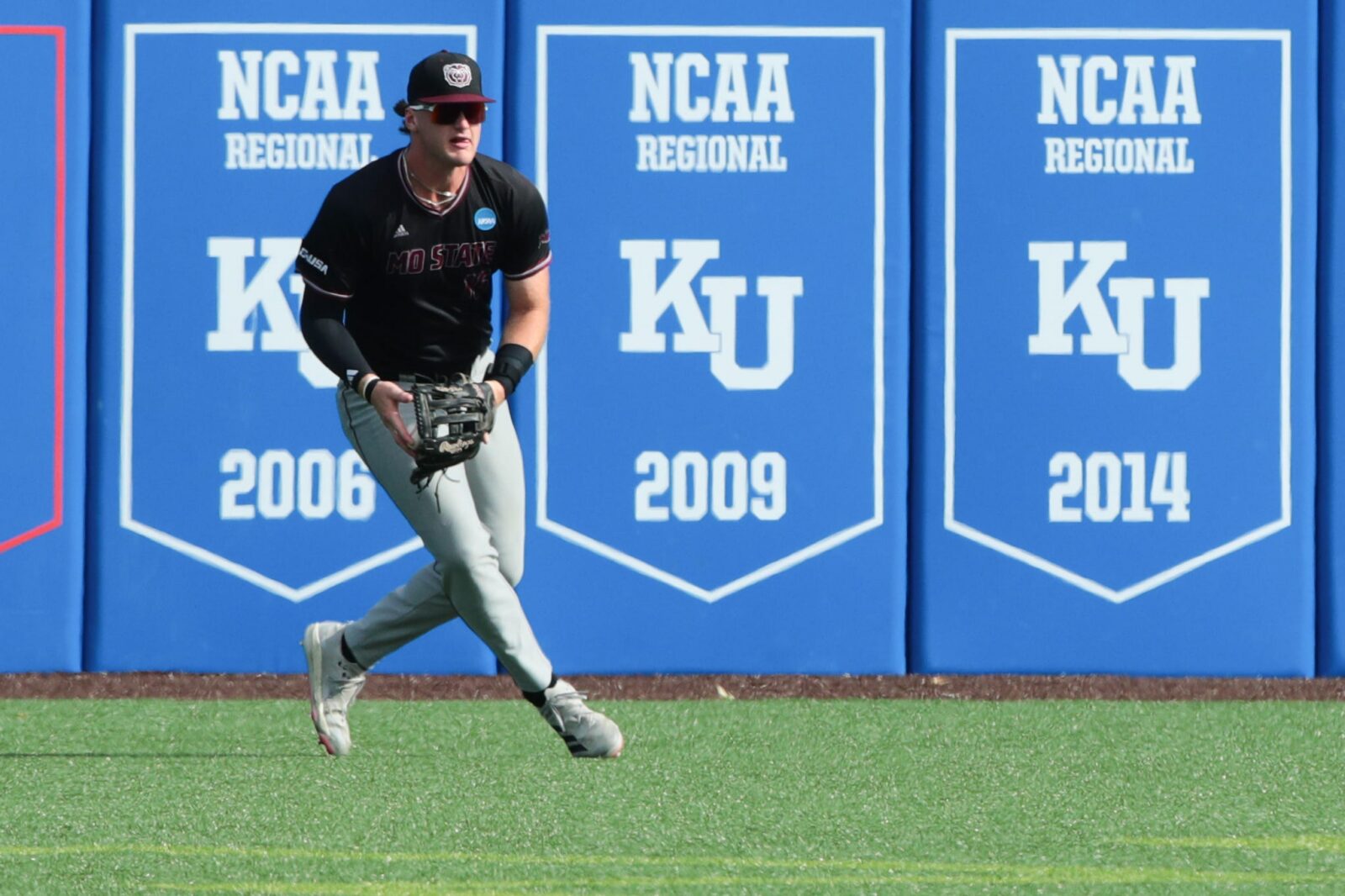 Missouri State junior outfielder Caden Bogenpohl (16) scoops up the ball after an Arkansas hit during the NCAA First Round of the Lawrence Regional at Hoglund Ballpark on May 29, 2026.