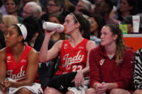 May 28, 2026; San Francisco, California, USA; Indiana Fever guard Caitlin Clark (22) drinks from her Gatorade bottle while resting on the bench with forward Monique Billings (25) and forward Grace VanSlooten (14) in the second quarter against the Golden State Valkyries at Chase Center. Mandatory Credit: David Gonzales-Imagn Images