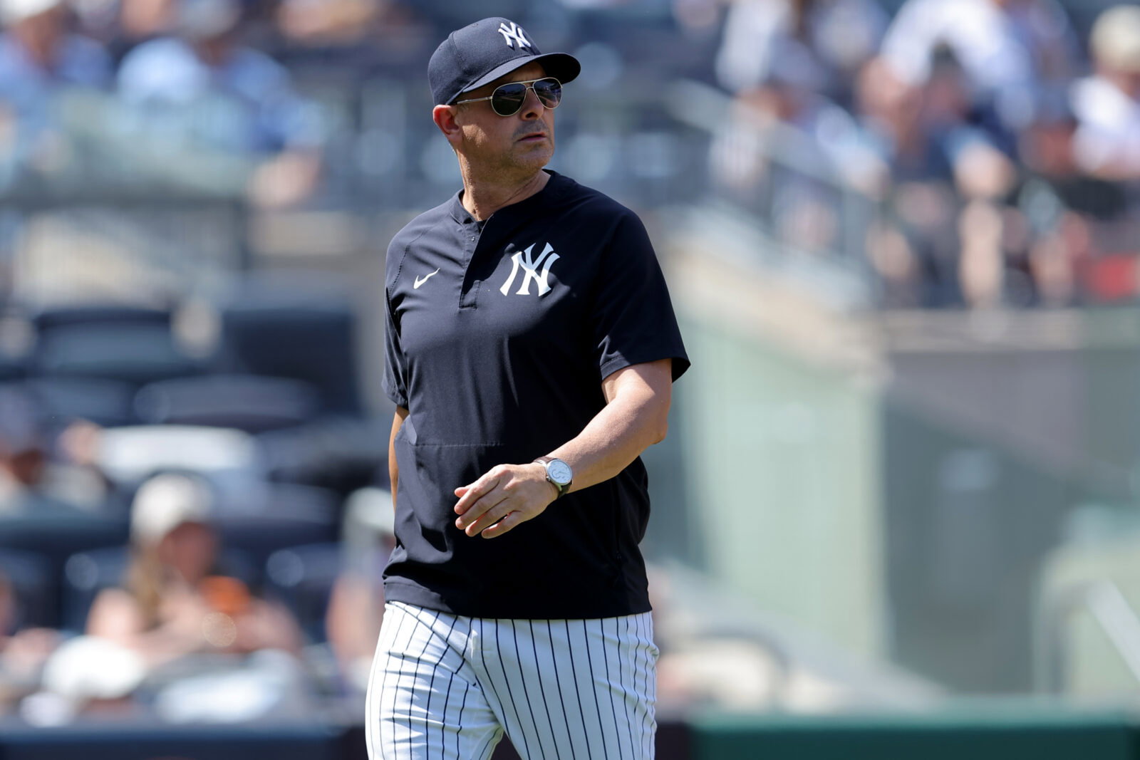 Jun 4, 2026; Bronx, New York, USA; New York Yankees manager Aaron Boone (17) walks back to the dugout after a conversation with third base umpire Laz Diaz (not pictured) between the top and bottom of the fifth inning against the Cleveland Guardians at Yankee Stadium. Mandatory Credit: Brad Penner-Imagn Images
