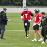 Jun 10, 2026; Florham Park, NY, USA; New York Jets quarterback Geno Smith (7) and quarterback Brady Cook (4) participate in a drill during minicamp at Atlantic Health Jets Training Center. Mandatory Credit: John Jones-Imagn Images