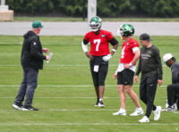 Jun 10, 2026; Florham Park, NY, USA; New York Jets quarterback Geno Smith (7) and quarterback Brady Cook (4) participate in a drill during minicamp at Atlantic Health Jets Training Center. Mandatory Credit: John Jones-Imagn Images