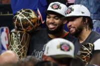 Jun 13, 2026; San Antonio, Texas, USA; New York Knicks center Karl-Anthony Towns (32) and Knicks guard Jalen Brunson (11) pose with the Larry O'Brien and Finals MVP trophies, respectively, during the championship trophy ceremony after game five of the 2026 NBA Finals against the San Antonio Spurs at Frost Bank Center. Mandatory Credit: Geoff Burke-Imagn Images