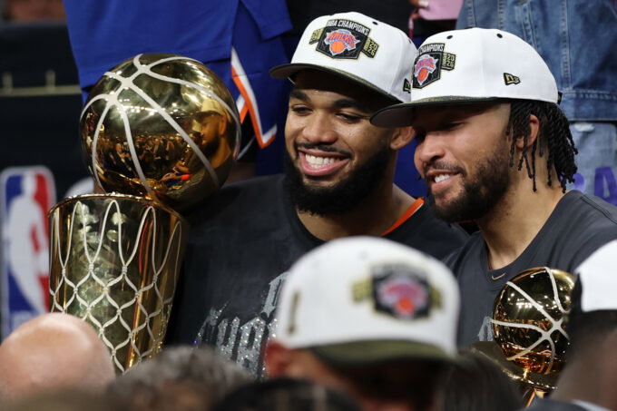 Jun 13, 2026; San Antonio, Texas, USA; New York Knicks center Karl-Anthony Towns (32) and Knicks guard Jalen Brunson (11) pose with the Larry O'Brien and Finals MVP trophies, respectively, during the championship trophy ceremony after game five of the 2026 NBA Finals against the San Antonio Spurs at Frost Bank Center. Mandatory Credit: Geoff Burke-Imagn Images