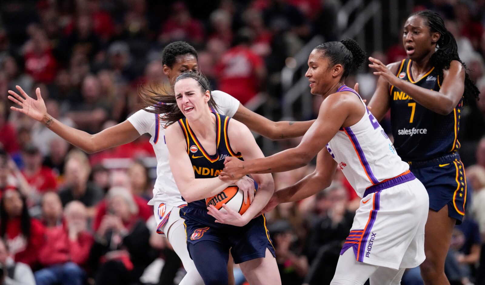 Phoenix Mercury forward Alyssa Thomas (25) attempts to strip the ball from Indiana Fever guard Caitlin Clark (22) on Monday, June 22, 2026, during the game at Gainbridge Fieldhouse in Indianapolis. The Indiana Fever defeated the Phoenix Mercury, 86-77. Credit: Grace Hollars/IndyStar / USA TODAY NETWORK via Imagn Images