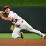 Jun 24, 2026; St. Louis, Missouri, USA; St. Louis Cardinals second baseman JJ Wetherholt (26) throws from his knees against the Arizona Diamondbacks during the seventh inning at Busch Stadium. Mandatory Credit: Jeff Curry-Imagn Images