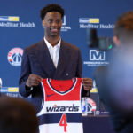 Jun 25, 2026; Washington, DC, USA; Washington Wizards first round draft pick and number one overall pick AJ Dybantsa poses for a photo with his jersey during a press conference at InterContinental Hotel. Mandatory Credit: Amber Searls-Imagn Images