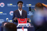 Jun 25, 2026; Washington, DC, USA; Washington Wizards first round draft pick and number one overall pick AJ Dybantsa poses for a photo with his jersey during a press conference at InterContinental Hotel. Mandatory Credit: Amber Searls-Imagn Images