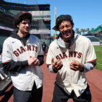 Jun 27, 2026; San Francisco, California, USA; Golden State Warriors 2026 NBA Draft picks Yaxel Lendeborg (right) and Lajae Jones react before a game between the Atlanta Braves and San Francisco Giants at Oracle Park. Mandatory Credit: Robert Edwards-Imagn Images
