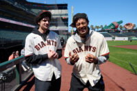 Jun 27, 2026; San Francisco, California, USA; Golden State Warriors 2026 NBA Draft picks Yaxel Lendeborg (right) and Lajae Jones react before a game between the Atlanta Braves and San Francisco Giants at Oracle Park. Mandatory Credit: Robert Edwards-Imagn Images
