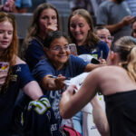 Jul 2, 2026; Hartford, Connecticut, USA; Dallas Wings guard Paige Bueckers (5) signs autographs after warming up before the start of the game against the Connecticut Sun at PeoplesBank Arena. Mandatory Credit: David Butler II-Imagn Images