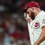 Jul 7, 2026; Cincinnati, Ohio, USA; Cincinnati Reds pitcher Caleb Ferguson (46) wipes his face as walks to the dugout after being pulled from the game against the Philadelphia Phillies in the eighth inning at Great American Ball Park. Mandatory Credit: Aaron Doster-Imagn Images