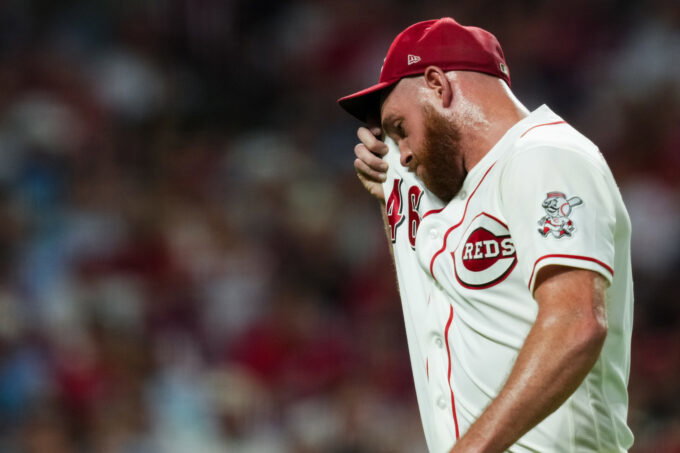 Jul 7, 2026; Cincinnati, Ohio, USA; Cincinnati Reds pitcher Caleb Ferguson (46) wipes his face as walks to the dugout after being pulled from the game against the Philadelphia Phillies in the eighth inning at Great American Ball Park. Mandatory Credit: Aaron Doster-Imagn Images