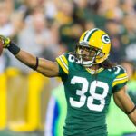 Sep 13, 2012; Green Bay, WI, USA; Green Bay Packers cornerback Tramon Williams (38) celebrates an interception during the game against the Chicago Bears at Lambeau Field. The Packers defeated the Bears 23-10. Mandatory Credit: Jeff Hanisch-USA TODAY Sports
