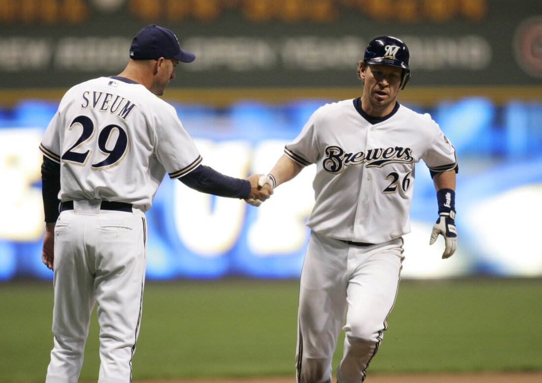 May 2, 2006; Milwaukee, WI, USA; Milwaukee Brewers catcher #26 Damian Miller is congratulated by third base coach #29 Dale Sveum after hitting a home run during the seventh inning against the Houston Astros at Miller Park. Mandatory Credit: Photo By Jeff Hanisch-USA TODAY Sports Copyright (c) 2006 Jeff Hanisch. Credit: IMAGN IMAGES via Reuters Connect